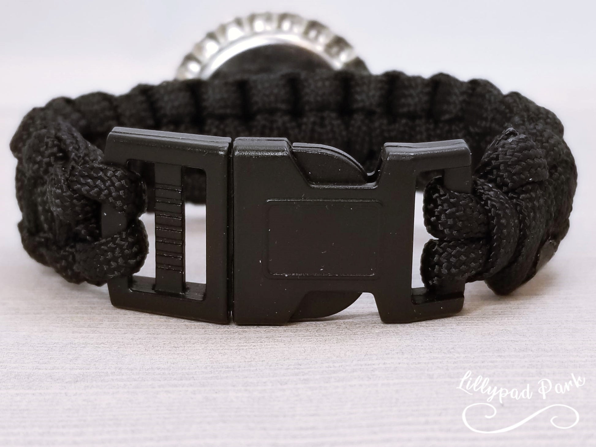 Handmade and hand braided paracord bracelet with bottle cap pendent